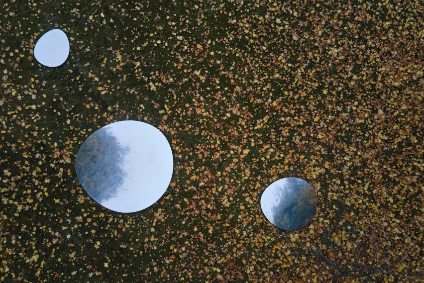 Aerial photograph of mirrors on ground around trees