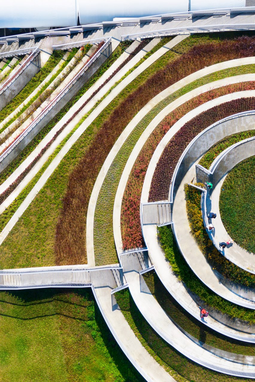 A series of stepped terraces filled with different coloured planting