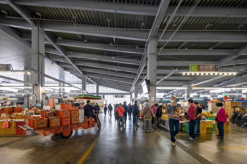 Open-air food market with tall ceilings