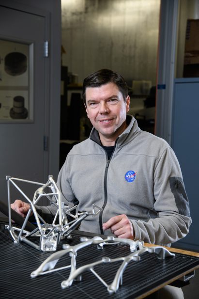 Ryan McClelland looking at NASA parts
