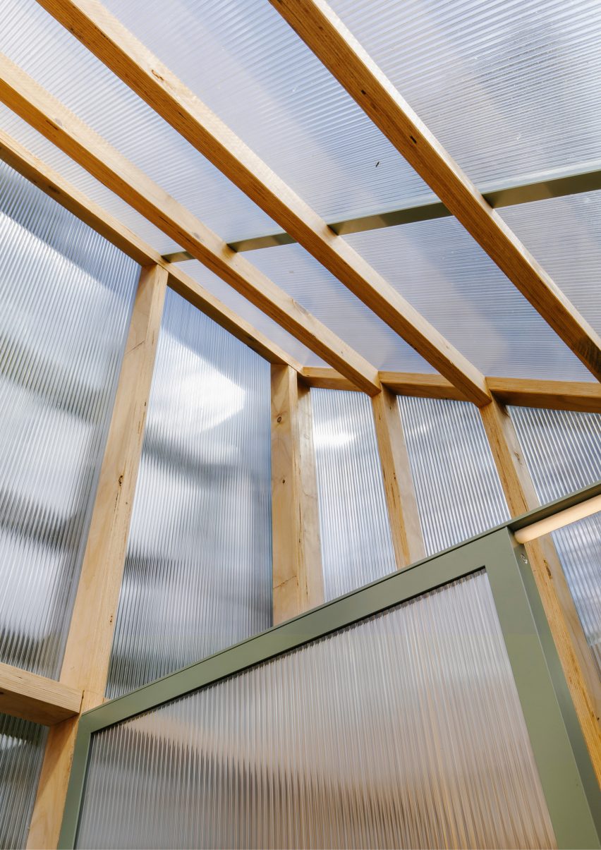 Interior of a polycarbonate shed with a mono-pitched roof and timber structure