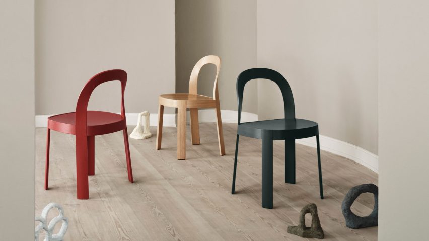 Three wooden chairs in beige interior