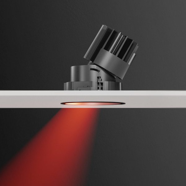 Tilted downlight recessed behind a white board producing a red light