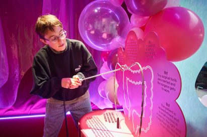 Wire loop game shaped like an intestine within exhibition about surgery by The Liminal Space