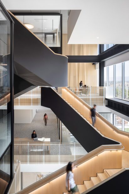 Hairpin staircases rise through atrium