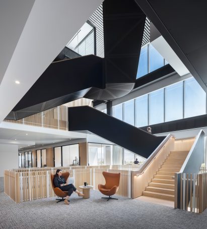 Atrium with glass facade and two staircases