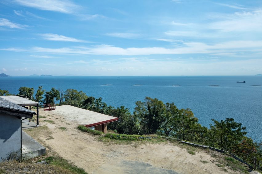A hillside overlooking the sea with buildings built into it