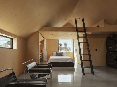 Neutral-toned bedroom and living space within bungalow unit