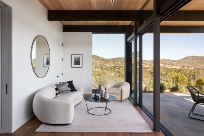 Interior living space that connects to outdoor patio with sliding glass doors