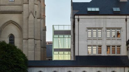 Exterior a cathedral and school with glass extension by Charles F Bloszies
