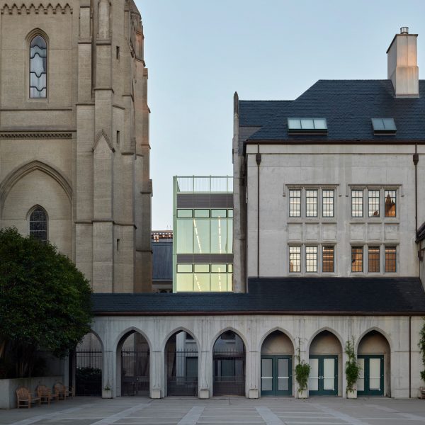 Exterior a cathedral and school with glass extension by Charles F Bloszies
