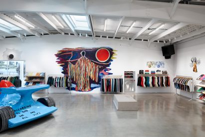 Polished concrete walls within illuminated interior of Supreme Los Angeles flagship store