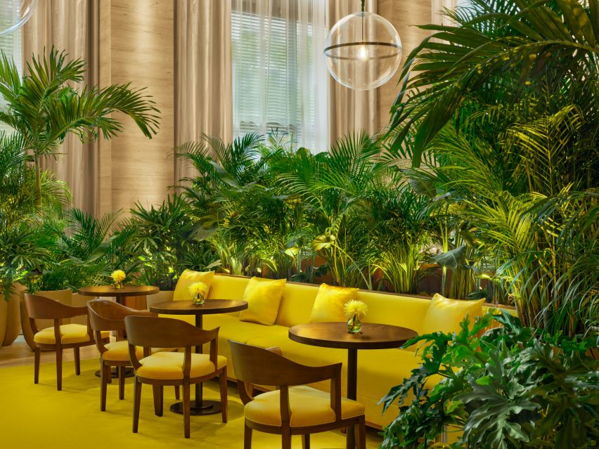 Bright yellow carpet and seating in the lobby