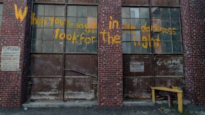 Facade with graffiti on The Last of Us set