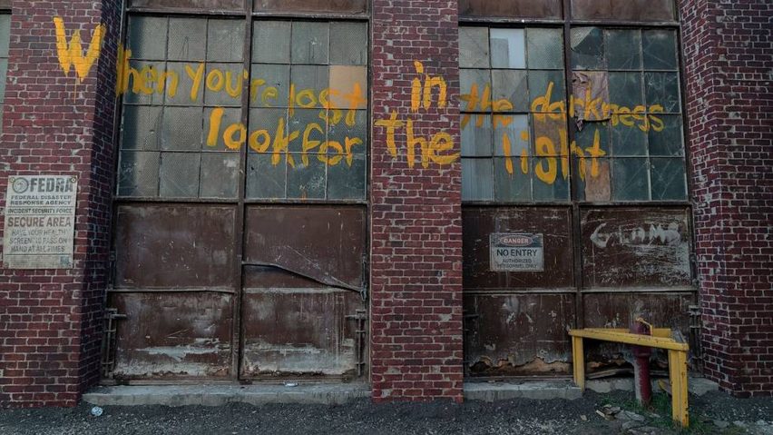 Facade with graffiti on The Last of Us set