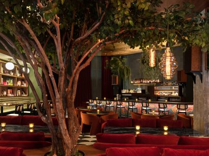 A life-like tree in the middle of the dining room