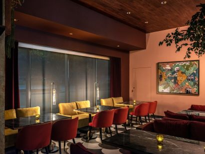Dining tables and a collage by Vernon Caldera
