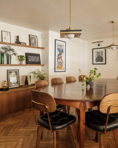 Office meeting room with parquet flooring wooden table and wooden chairs with black upholstered seats