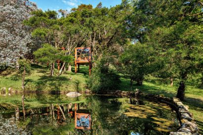 Treehouse on sloped site near pond in Brazil
