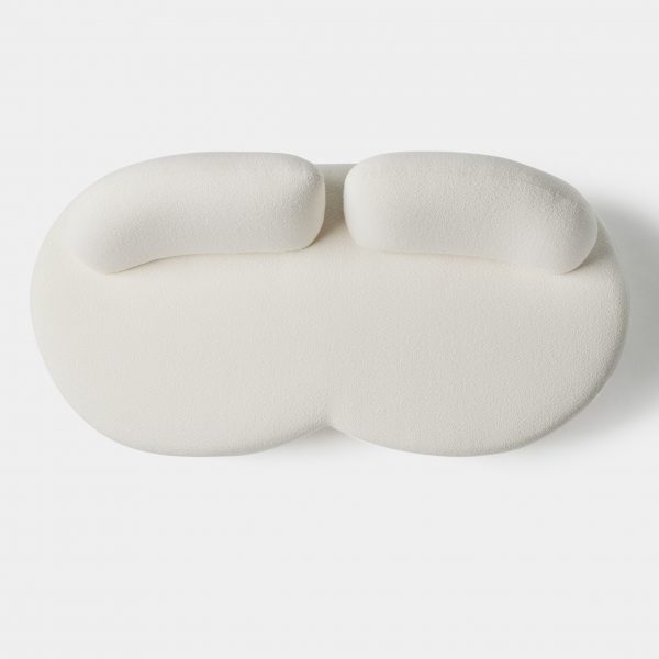 White seating on white background from above