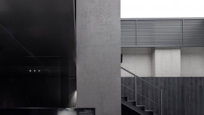 Grey and black PXG flagship store in Seoul by WGNB