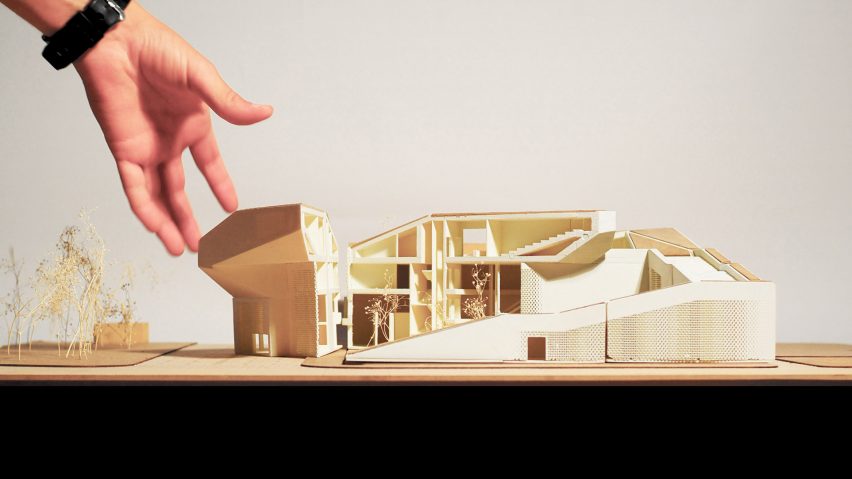 Elaborate architectural model in front of white backdrop