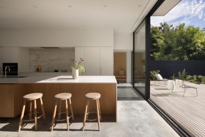 Floor-to-ceiling glazing opening onto decking within Vancouver home