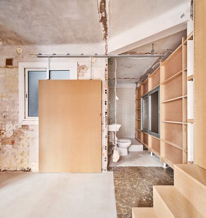 Wood-clad steps and walls within 10K House in Barcelona