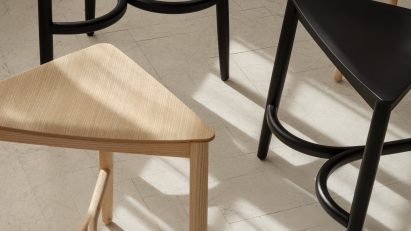 Three wooden stools on neutral coloured floor