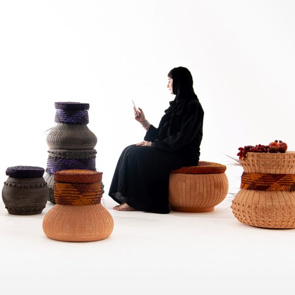 Photo of a person sat on a basket seat