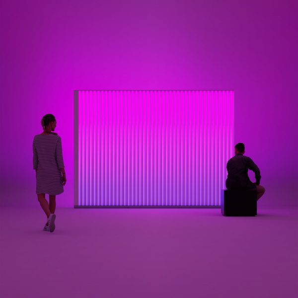 Photo of people sat in front of a screen