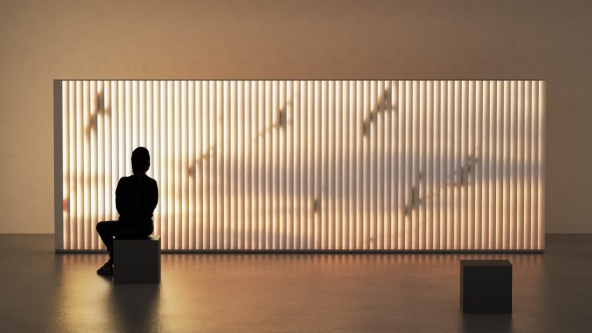 Photo of a person sat in front of a screen