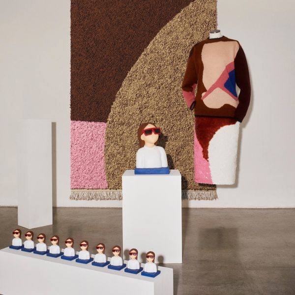 Photo of clothing, sculptures and a rug