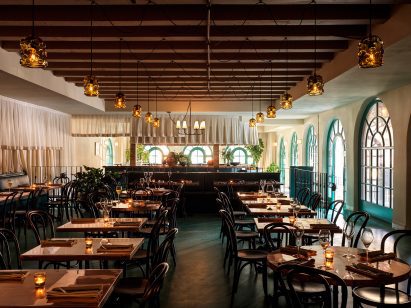 Dining room with copper tables and green floor