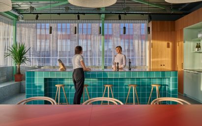 Communal turquoise island in pavilion kitchen