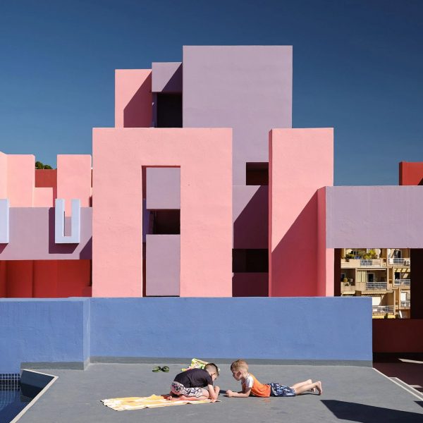 Two children playing on Muralla Roja roof