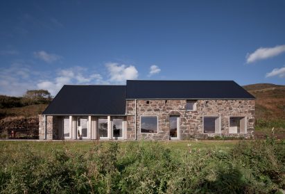 Two gabled volumes featuring stone that house the Croft 3 restaurant by Fardaa