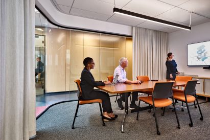 Carved wood-clad opening within interior of Harvard law centre