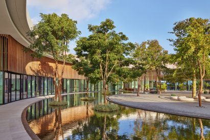 Water and wood siding with trees