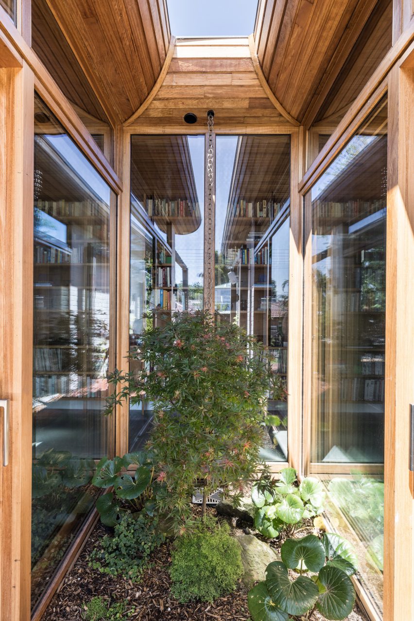 Outdoor courtyard space surrounded by glazed walls