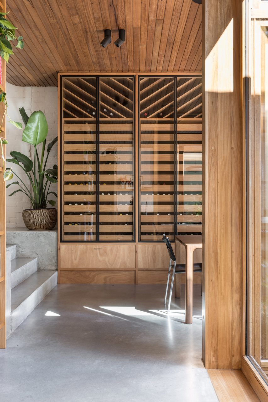 Room with concrete floors and steps and wooden storage