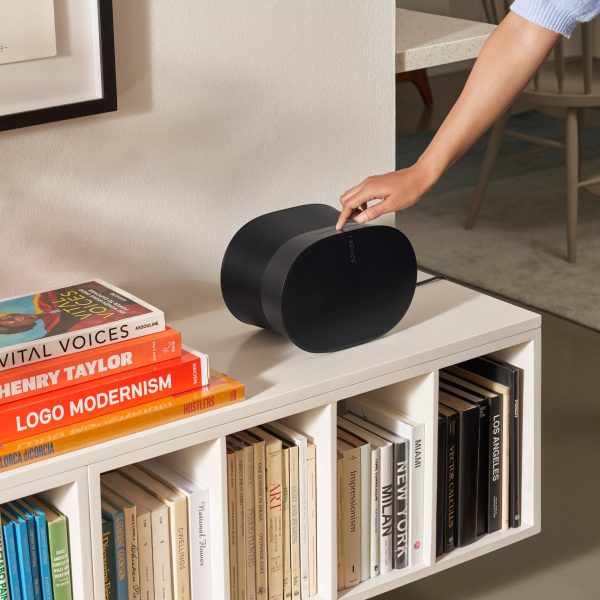 Era 300 smart speaker in black on top of a book shelf