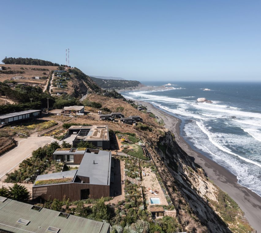 U-shaped home on a hillside overlooking the sea