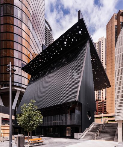 Side profile of the hut-like Sydney Plaza & Community Building 