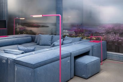 Integrated table in sofa at Carpenters Workshop Gallery