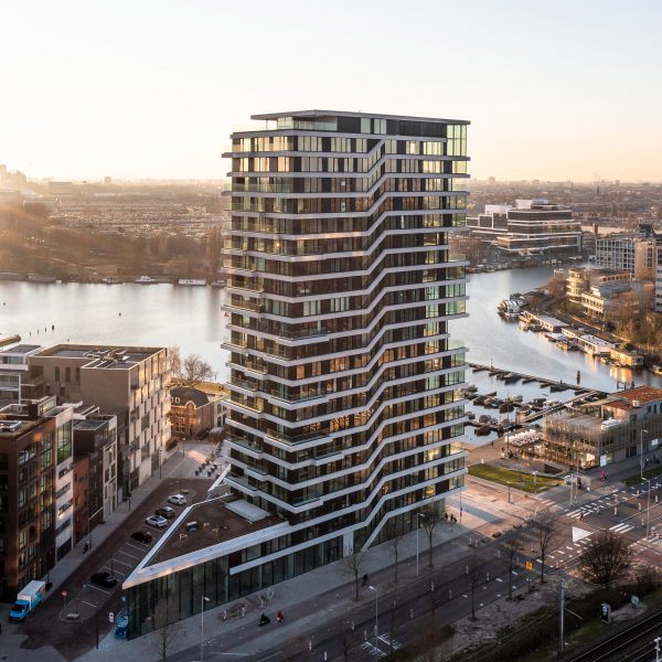 Exterior of the Haut mass-timber high-rise building in Amsterdam by the waterfront