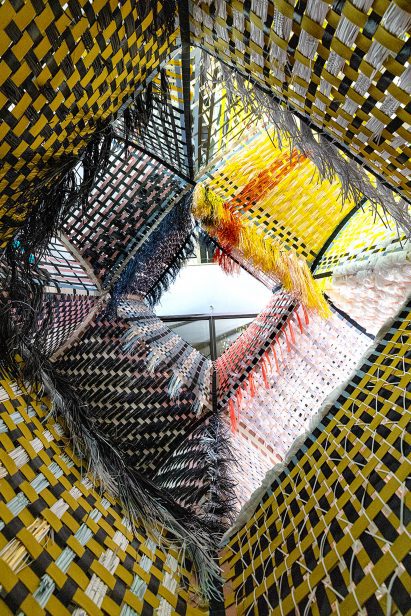 Multi-coloured Loom Room woven installation
