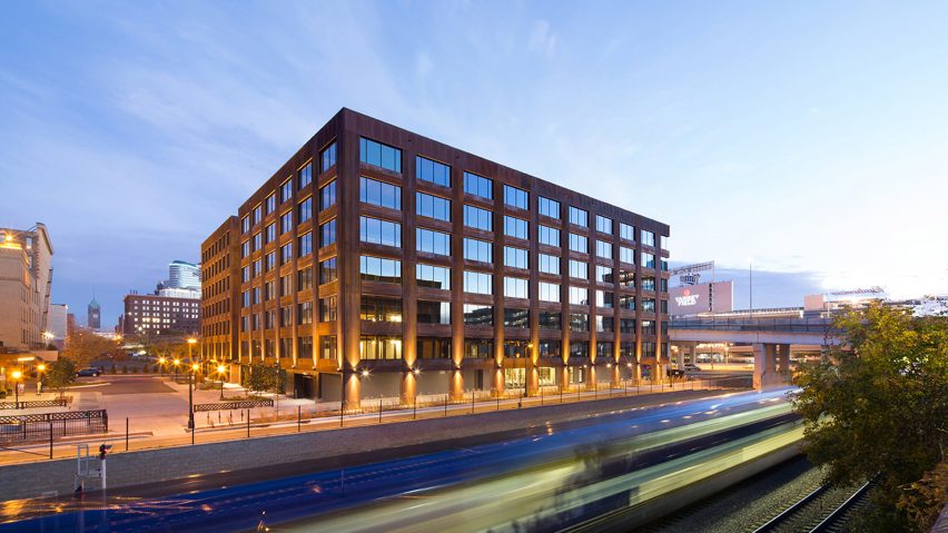 Exterior of the T3 office building with weathered steel cladding and grid windows