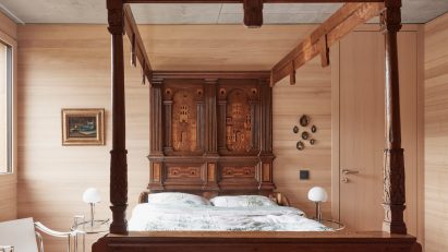 Four-poster bed in house designed by Bernardo Bader