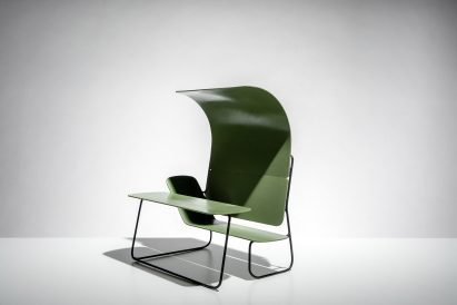Photograph showing chair with in built canopy and desk